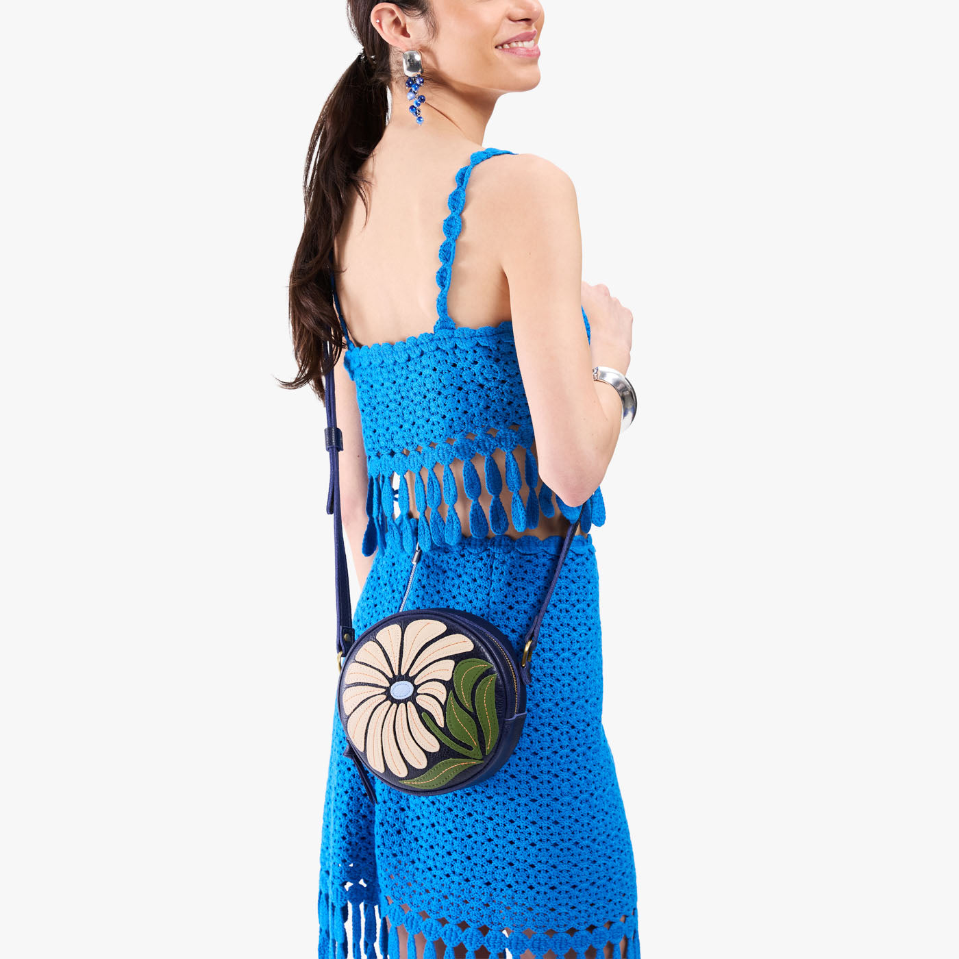 Wildflower Cobalt*Small | Model wearing circle shaped crossbody bag with top zipper