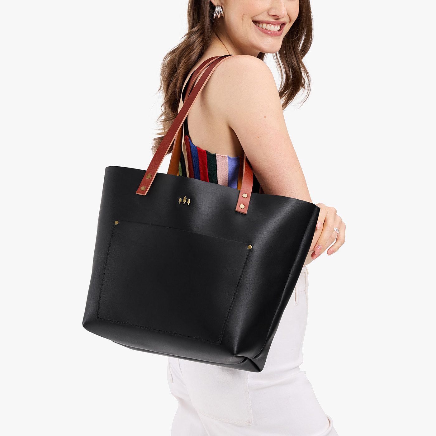 Black*Classic | Leather Tote Bag with bridle leather handles being held by a model