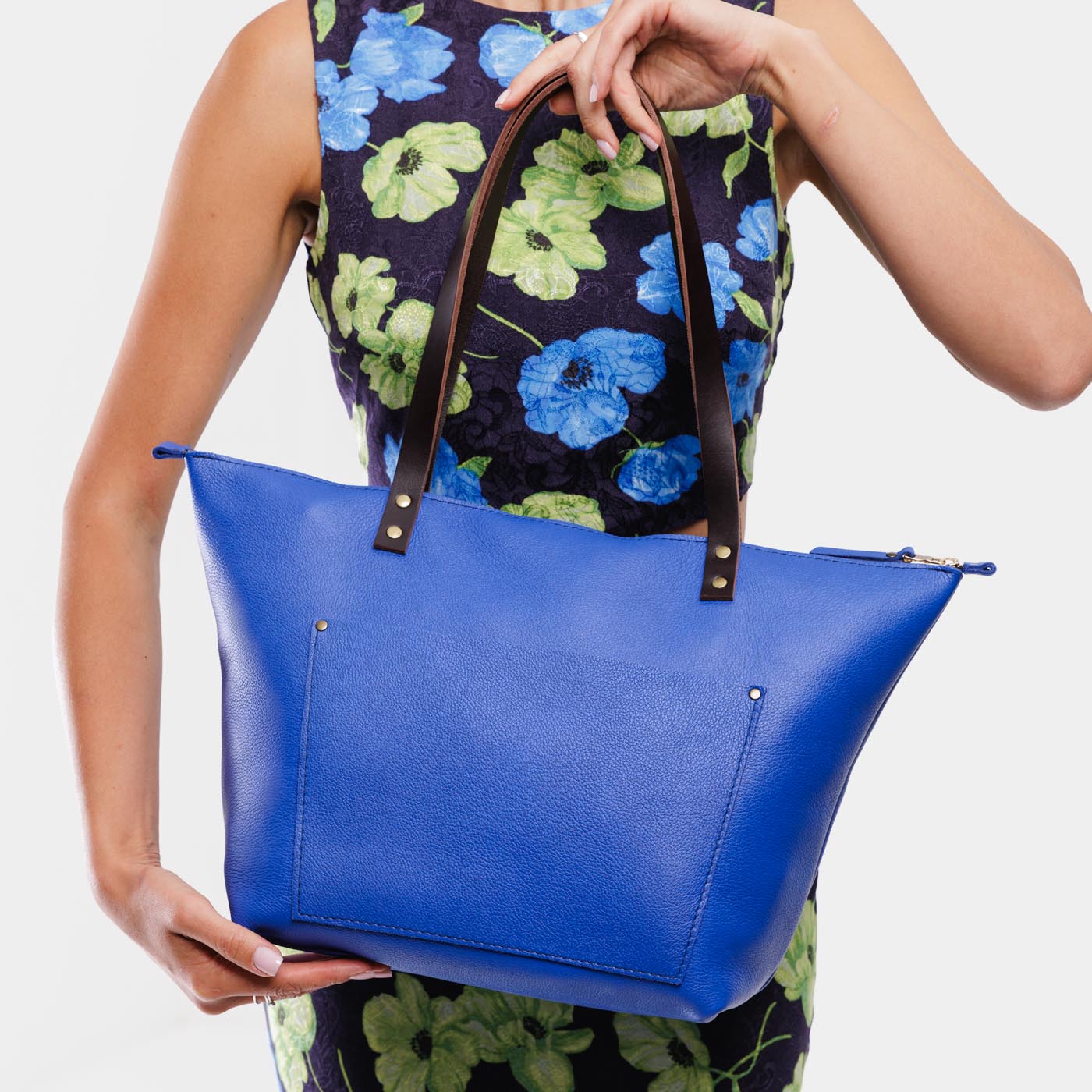 Astro Blue*Zipper | Model wearing large leather tote bag with sturdy bridle handles and front pocket
