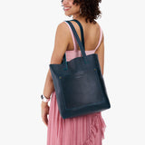 Boreal Classic | Model holding medium Tote with dual shoulder straps and crossbody strap