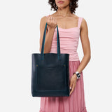 Boreal Classic | Model holding medium Tote with dual shoulder straps and crossbody strap