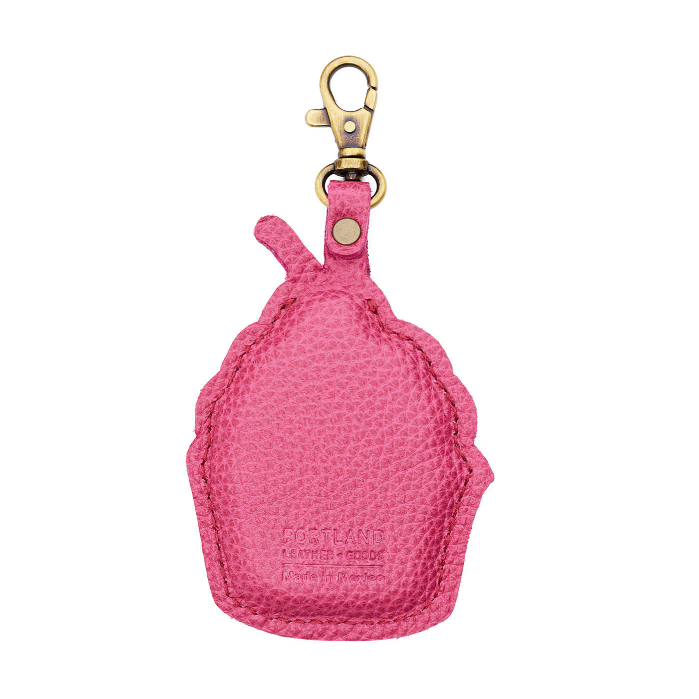 Wild Rose | Back of a cupcake-shaped leather keychain charm with cream-colored frosting, a red cherry on top