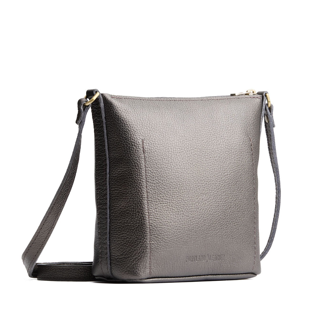 Stardust | Rectangular side bag with curved front pocket and metal tree shaped badge