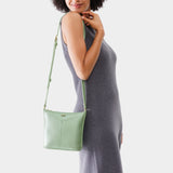 Beetle | Model wearing rectangular side bag with curved front pocket and metal tree shaped badge