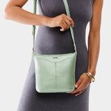 Beetle | Model wearing rectangular side bag with curved front pocket and metal tree shaped badge