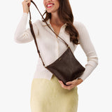 Coldbrew | Model wearing rectangular side bag with curved front pocket and metal tree shaped badge