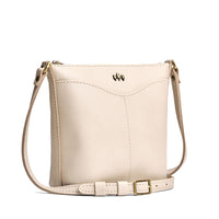 Pebbled Bone | Rectangular side bag with curved front pocket and metal tree shaped badge