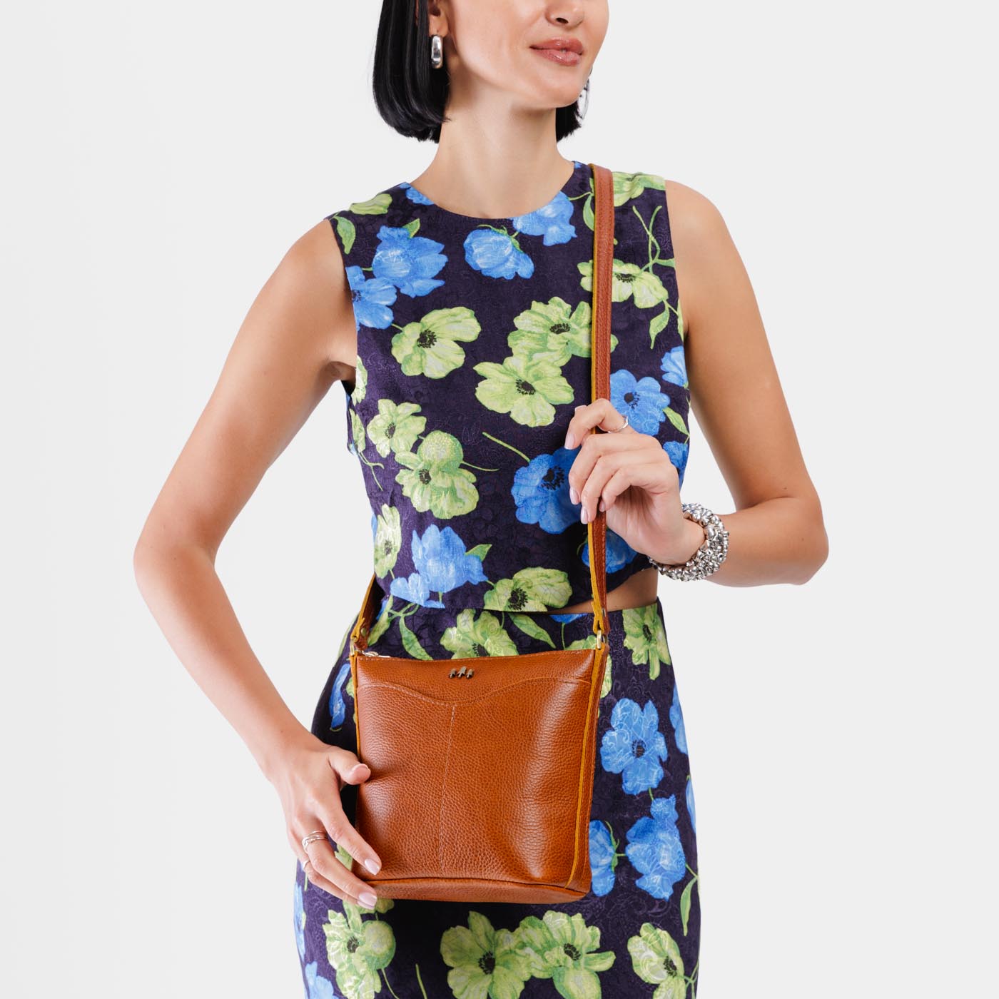 Sienna | Model wearing rectangular side bag with curved front pocket and metal tree shaped badge