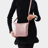 Supernova | Model wearing rectangular side bag with curved front pocket and metal tree shaped badge