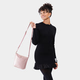 Supernova | Model wearing rectangular side bag with curved front pocket and metal tree shaped badge