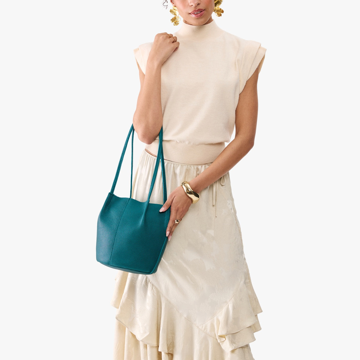 Aquarius*Classic | Model wearing matching white shirt and skirt carrying petite bucket shaped tote bag with matching leather handles