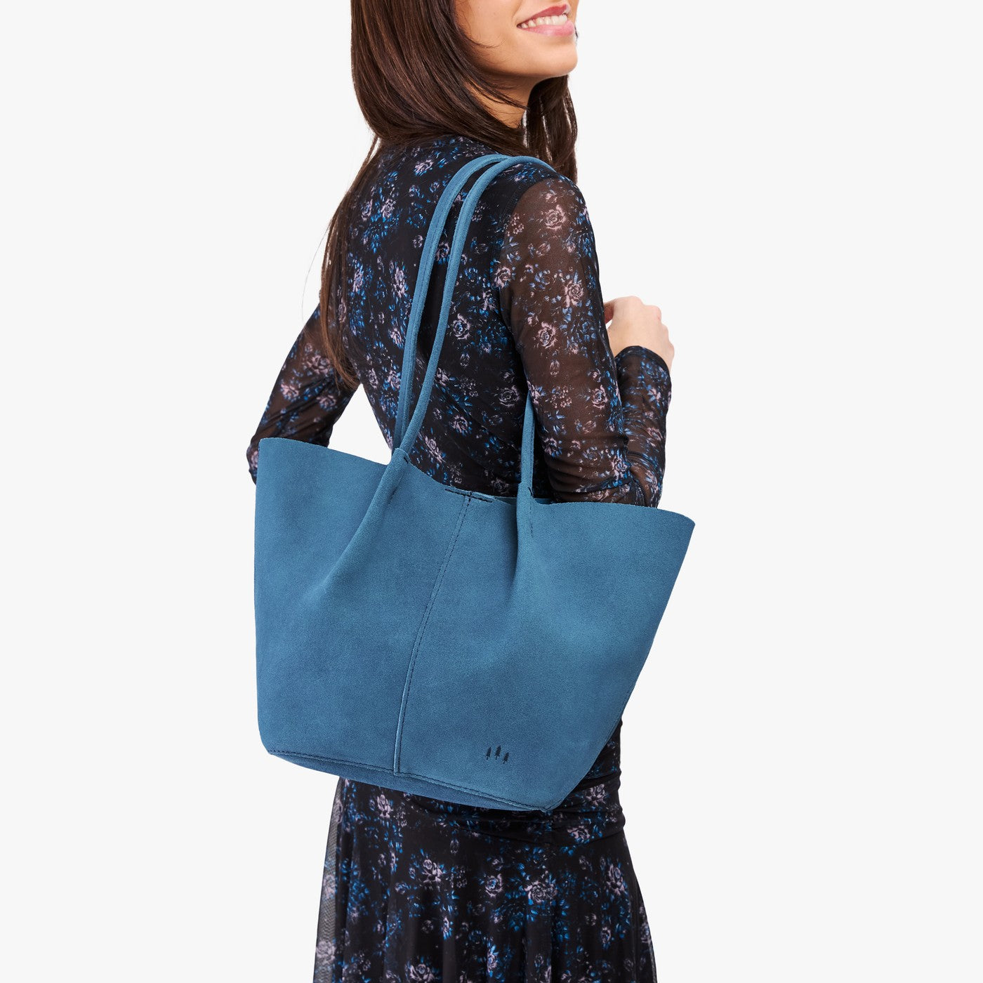 Mariner Blue*Large | Model holding wide bucket shaped tote bag with matching leather handles
