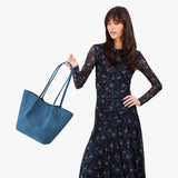 Mariner Blue Large | Model holding wide bucket shaped tote bag with matching leather handles