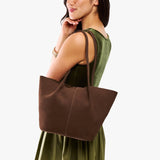 Stagecoach Large | Model holding wide bucket shaped tote bag with matching leather handles