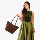 Stagecoach Large | Model holding a  leather tote bag 