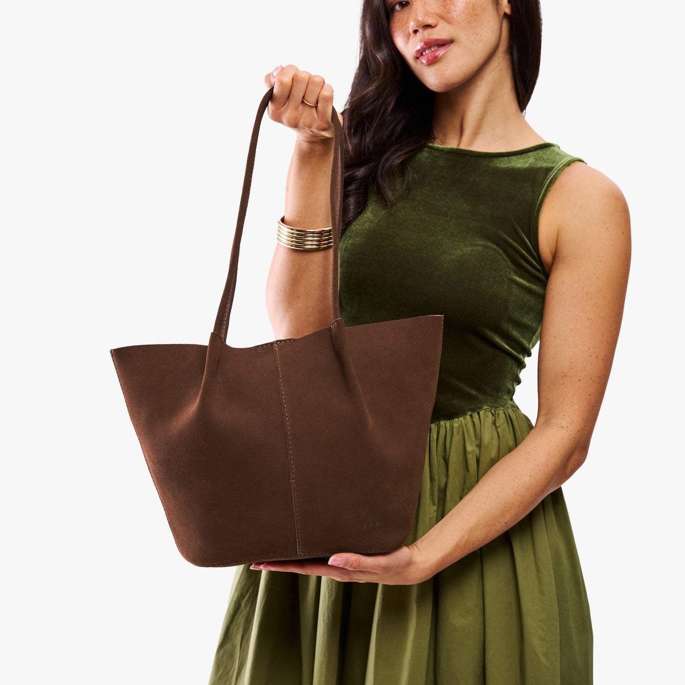 Stagecoach*Large | Model holding wide bucket shaped tote bag with matching leather handles