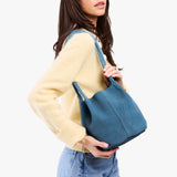 Mariner Blue Classic | Model holding a  leather tote bag 