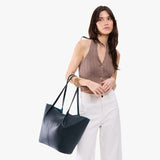 Boreal Oversized | Model carrying extra wide bucket shaped tote bag with matching leather handles