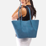 Mariner Blue Oversized | Model holding extra wide bucket shaped tote bag with matching leather handles