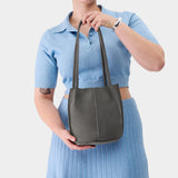 Smoke Grey Classic | Model holding a  leather tote bag 