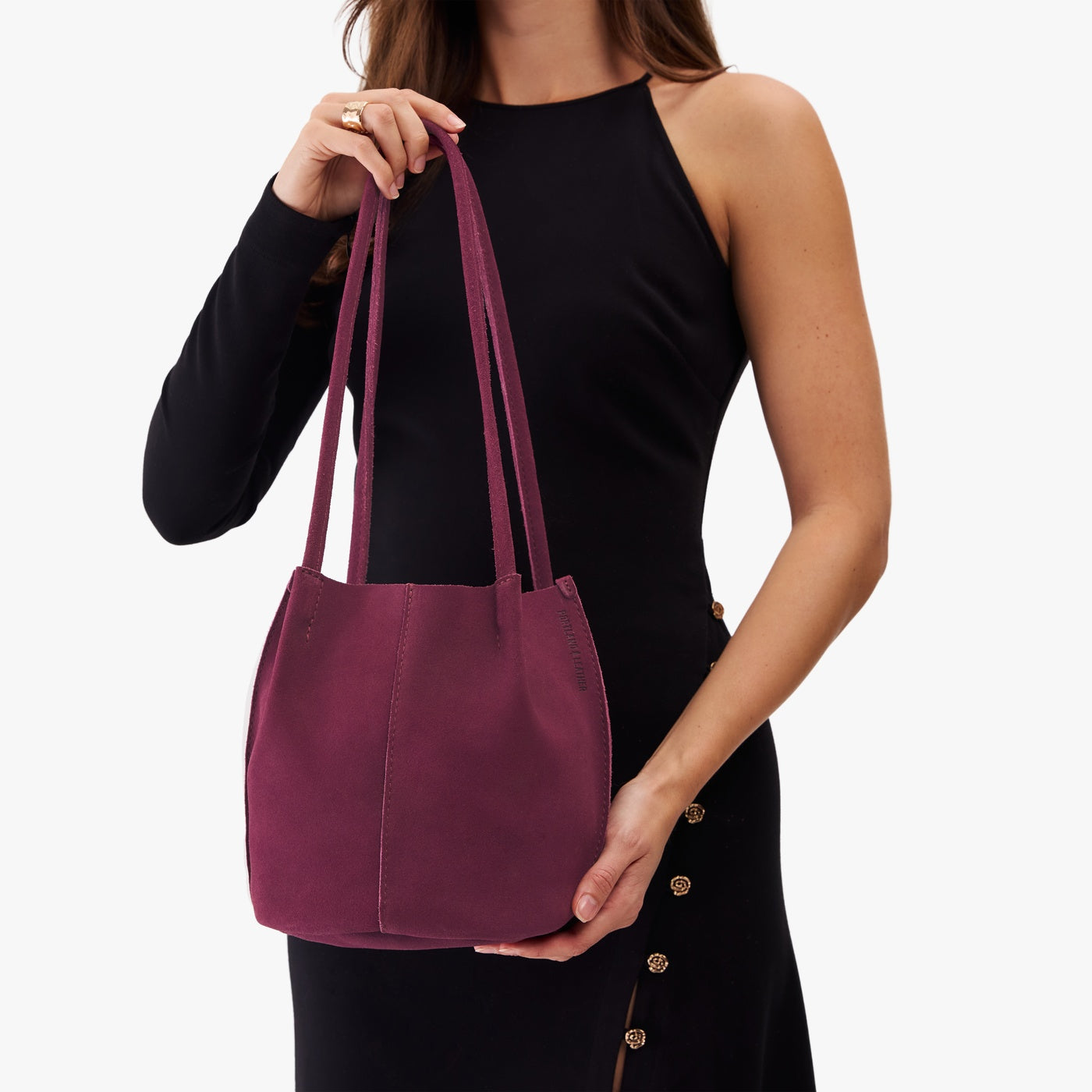 Superbloom*Classic | Model holding a  leather tote bag 