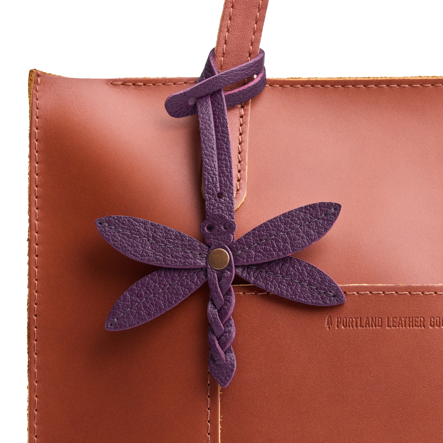 Plum | Dragonfly shaped leather charm tassel on bag 