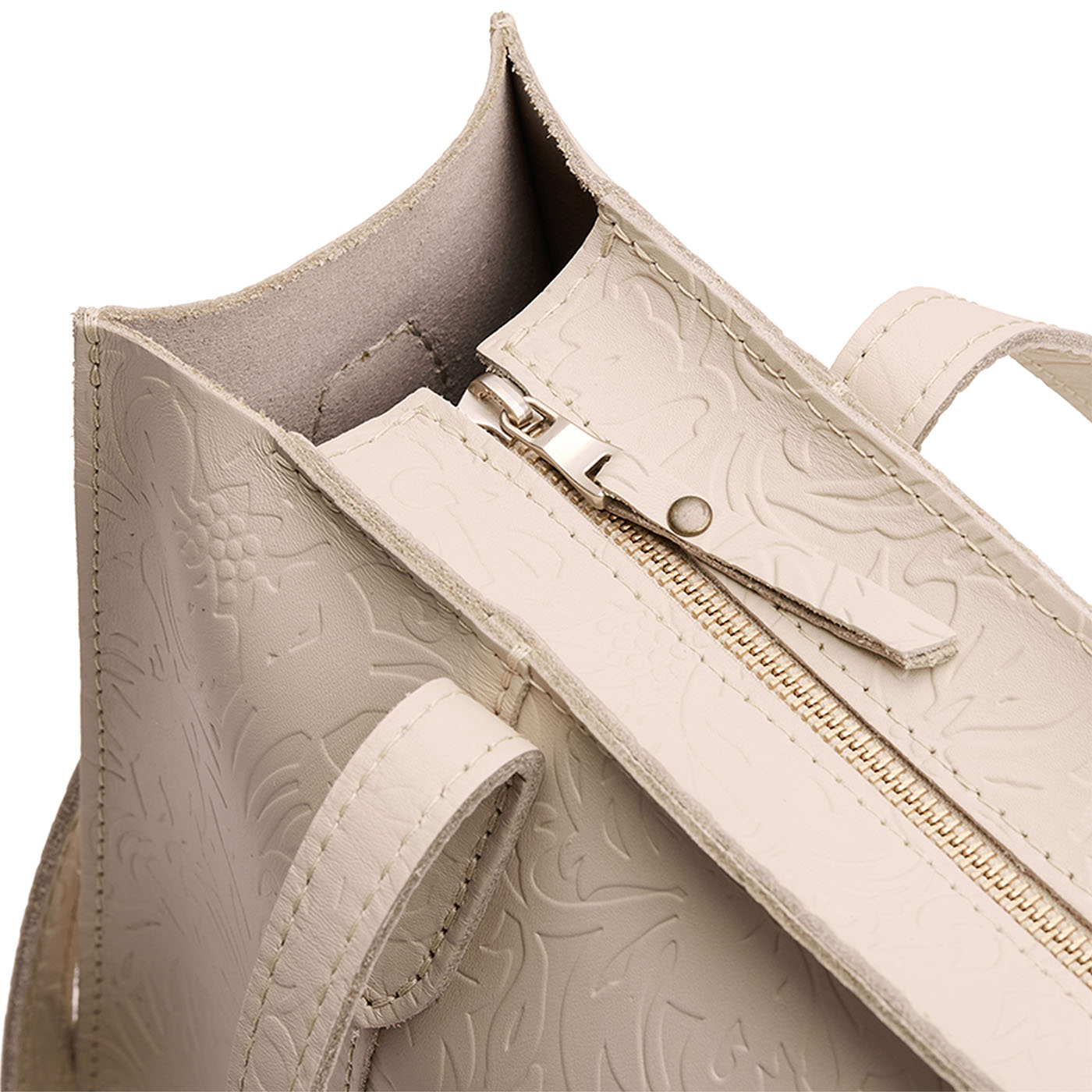 Jasmine | Close-up of zipper top on structured wide embossed leather tote bag with overlapping panels and crossbody strap