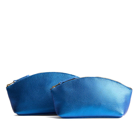 Comet Blue | Spacious leather makeup bag with curved seams and top zipper