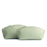 Pistachio | Spacious leather makeup bag with curved seams and top zipper