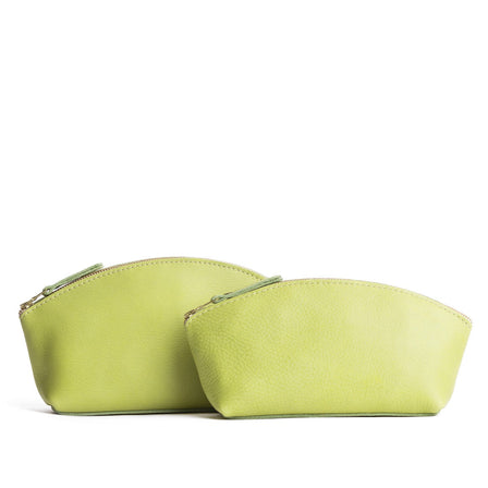Sugar Snap | Size comparison shot of two spacious leather makeup bags with curved seams and top zipper