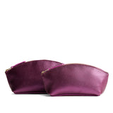 Ultra Violet | Spacious leather makeup bag with curved seams and top zipper