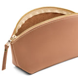 Rodeo Eclipse | Close-up of spacious leather makeup bag with curved seams and top zipper open