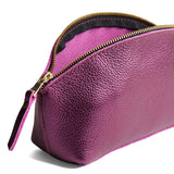 Ultra Violet | Spacious leather makeup bag with curved seams and top zipper