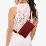 Phoenix | Model wearing envelope shaped clutch wallet with crossbody strap