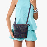 Carnival | Model wearing small rectangular crossbody purse with top zipper and interior pocket