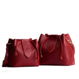 Chili Red | Small and large symmetrical leather bags with leather drawstring closure and adjustable shoulder strap
