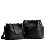 Pebbled--black | Small and large symmetrical leather bags with leather drawstring closure and adjustable shoulder strap