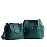 Sea Glass | Small and large symmetrical leather bags with leather drawstring closure and adjustable shoulder strap