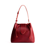 Chili Red Large | Symmetrical leather bag with leather drawstring closure and adjustable shoulder strap