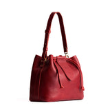Chili Red Large | Symmetrical leather bag with leather drawstring closure and adjustable shoulder strap
