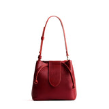 Chili Red Small | Symmetrical leather bag with leather drawstring closure and adjustable shoulder strap