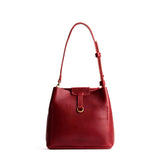 Chili Red Small | Symmetrical leather bag with leather drawstring closure and back ring for accessories