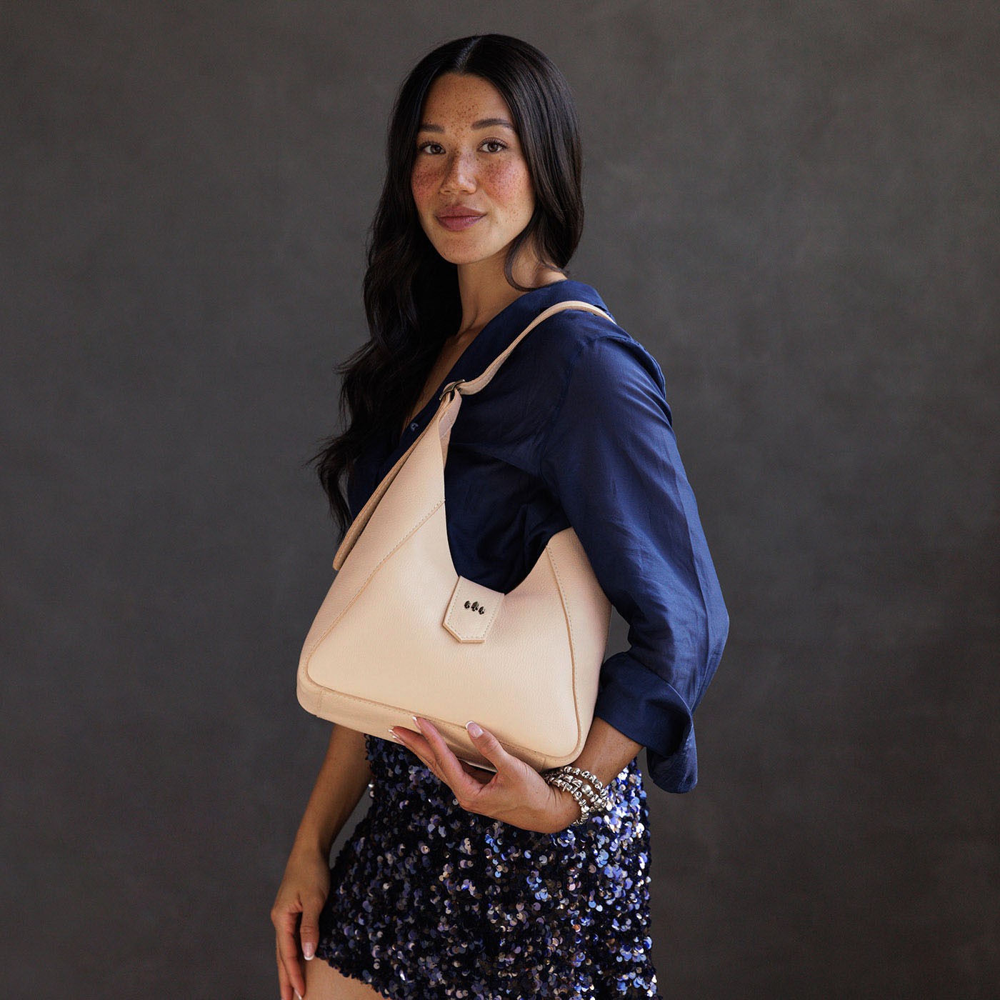 Moonflower | Model wearing structured hobo shoulder bag with adjustable strap and magnetic closure