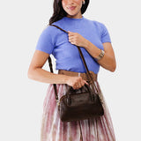 Coldbrew Large | A large bowler styled bag with a crossbody strap being worn by a model 