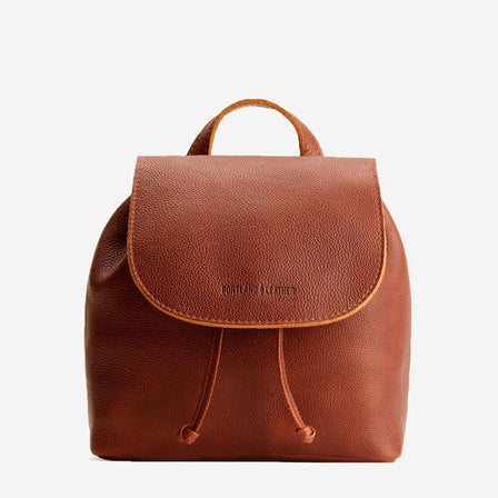 Nutmeg | Drawstring bucket backpack with snap closure under flap