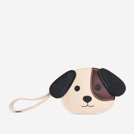 Oatmilk | A small dog-shaped leather pouch with embroidered facial details and a wrist strap.