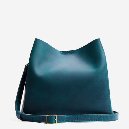 Westward Blue | Symmetrical bucket bag with latch closure and removable crossbody strap