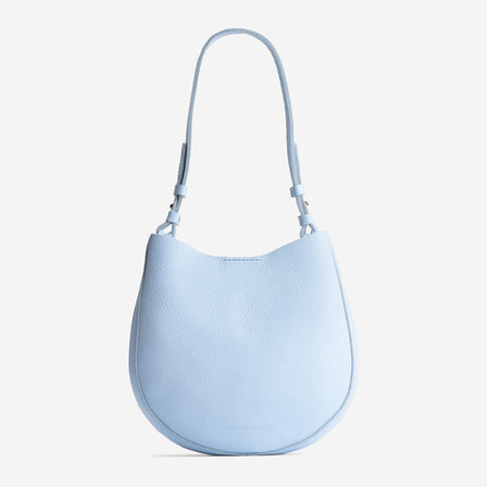 Skyway*Medium | Rounded shoulder bag with adjustable strap on a white background