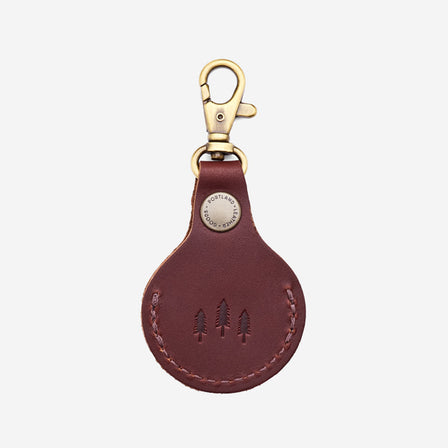 Cognac | Round leather AirTag holder with snap closure and swivel lobster claw clasp