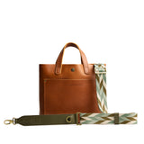 Everfield | Patterned fabric and leather strap attached to leather purse on a white background